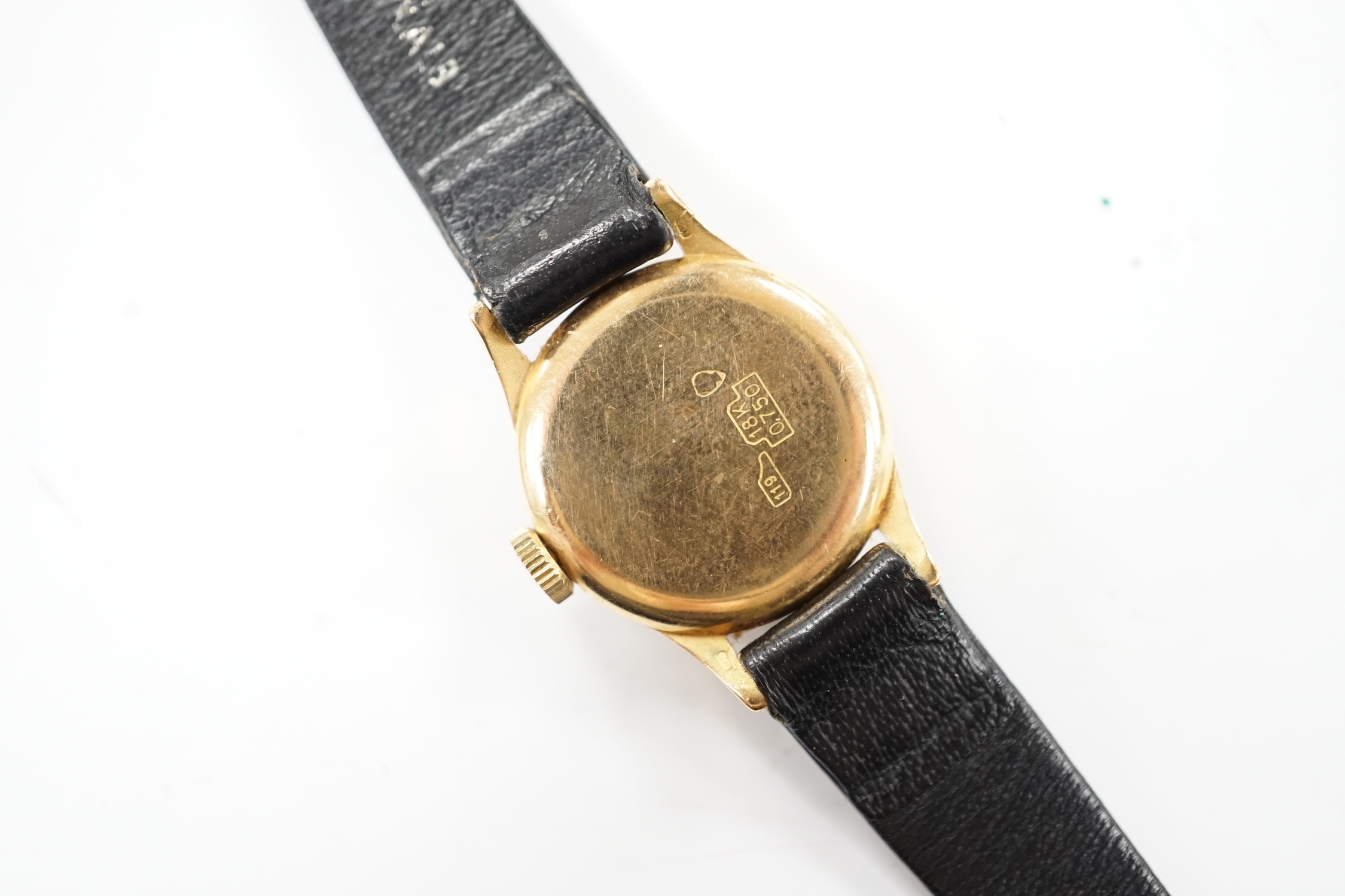 A lady's Swiss Sabina 18k manual wind wrist watch, on a leather strap.